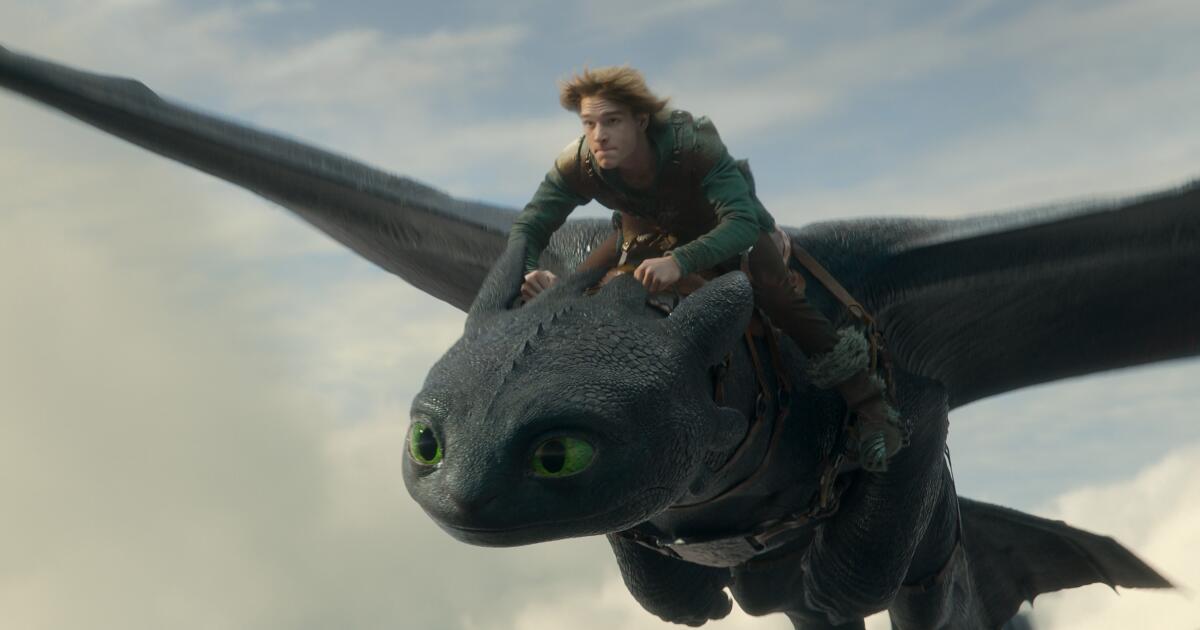 Toothless from How to Train Your Dragon in flight with rider